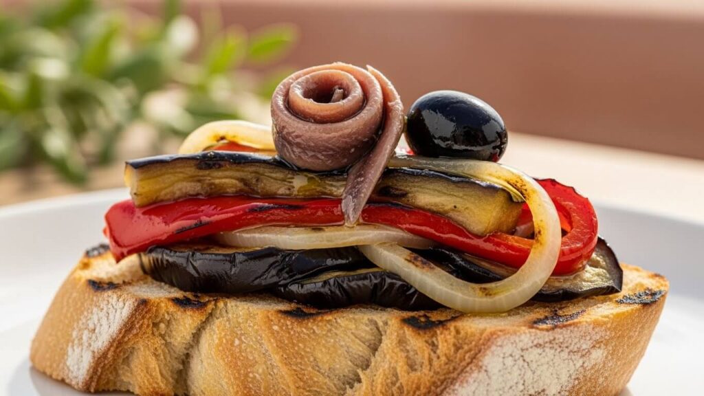 Escalivada served on toasted bread with anchovies (tostada).