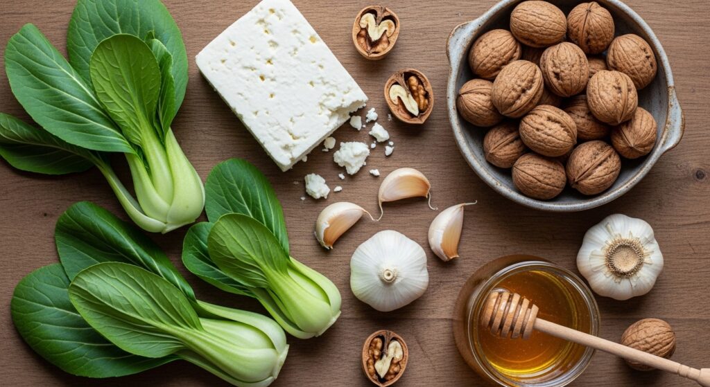 Raw ingredients for caramelized bok choy recipe including feta and walnuts.