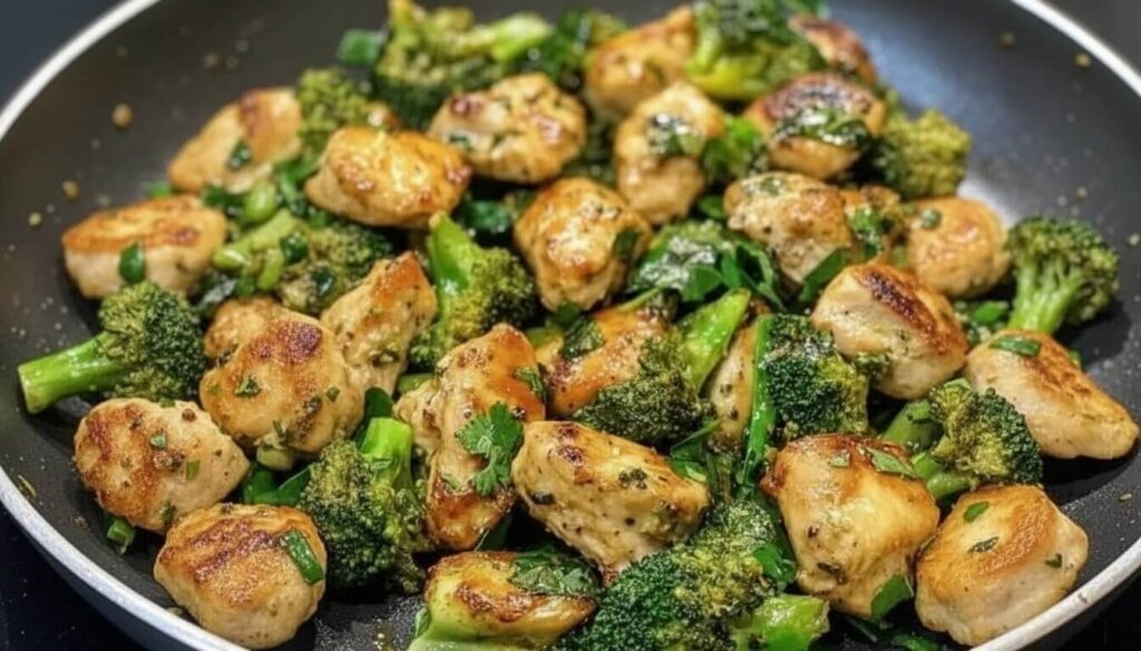 One pan Mediterranean Garlic Chicken with Broccoli and Spinach in a skillet.