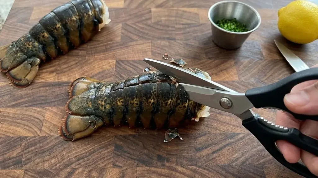 How to butterfly a lobster tail using kitchen shears.