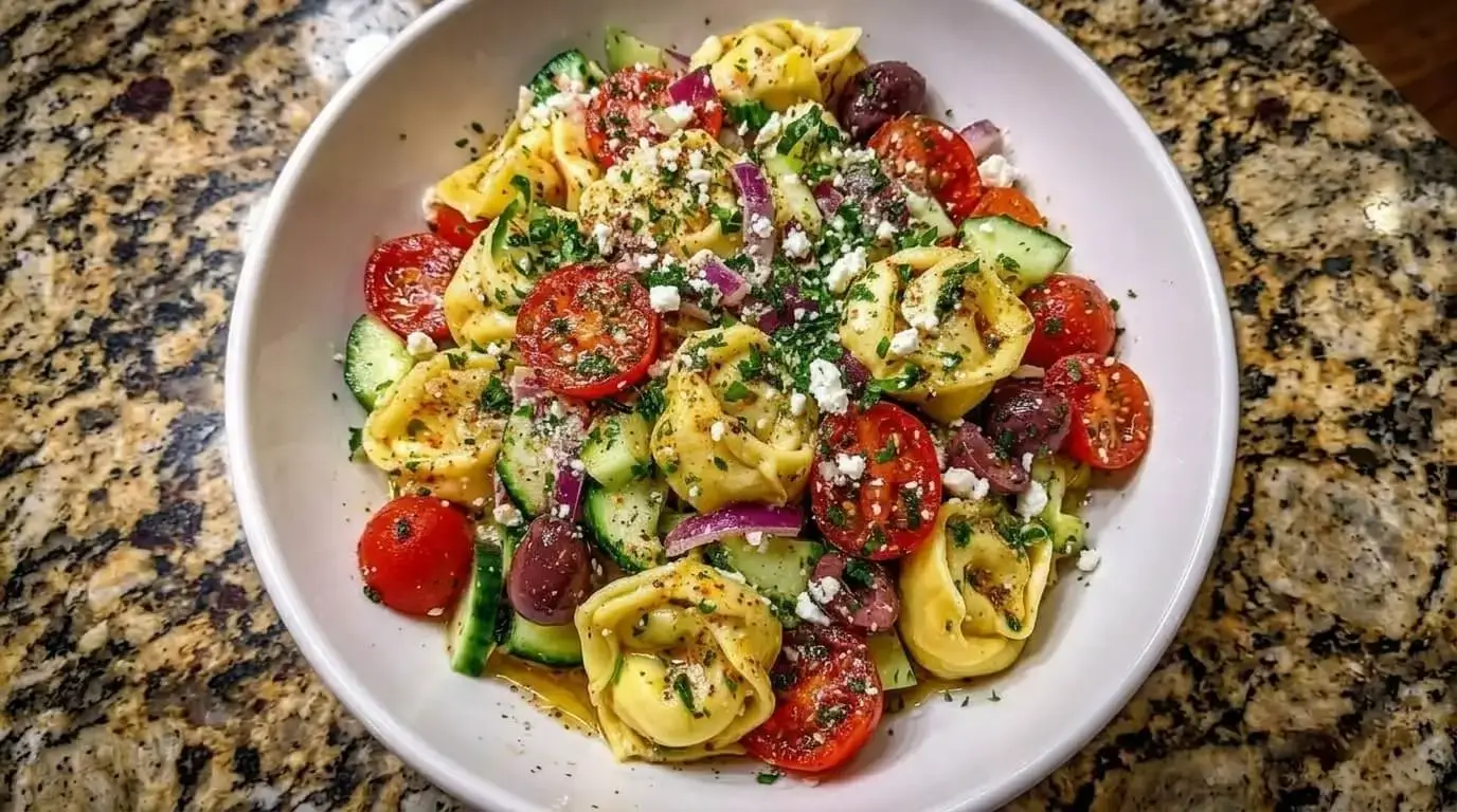 Greek Tortellini Pasta Salad with feta cheese, cucumber, cherry tomatoes and Kalamata olives